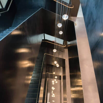 Side View Of Custom Staircase With Round Lights